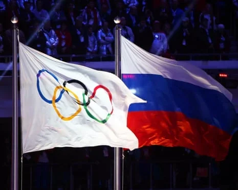 The Olympic flag flies alongside the Russia flag at Sochi in 2014